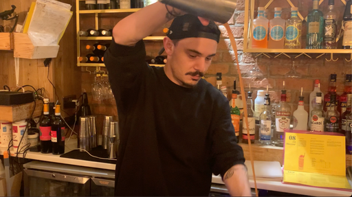 Instructor teaching Espresso Martini steps in a hands-on private mixology class