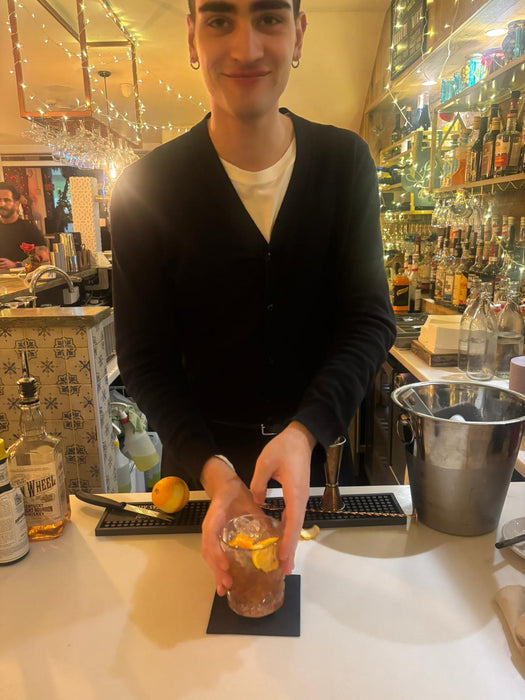 Mattia presenting a cocktail to the class during the practical bartender session
